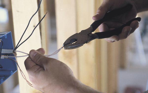 Electrician Working With Wiring